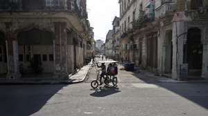 epa13083800 People are riding in a bicycle taxi in Havana, Cuba, 02 July 2026 (issued 03 July 2026). Six months of a US 'maximum pressure' campaign have left Cuba facing a surge in power outages. The policy uses a strict oil embargo, economic sanctions, and implicit threats of military intervention to isolate the island nation.  EPA/Ernesto Mastrascusa