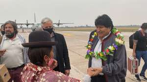 epa08808994 A handout photo made available by Evo Morales press office shows former President of Bolivia, Evo Morales (R), as he greets an indigenous woman upon arrival in the Province of Jujuy, Argentina, 08 November 2020. Morales plans to return to his country after a year of exile, stating that he was forced by a coup. He is expected to be received by a caravan as soon as he enters Bolivia from the border with Argentina, where he has remained since his departure from his home country.  EPA/EVO MORALES PRESS OFFICE / HANDOUT  HANDOUT EDITORIAL USE ONLY/NO SALES