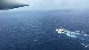 epa10706581 A handout photo made available by the US Coast Guard shows a Coast Guard Air Station Elizabeth City, North Carolina HC-130 Hercules airplane flies over the French research vessel, L'Atalante approximately 900 miles East of Cape Cod during the search for the 21-foot submersible, Titan, in Boston, Massachusetts, USA, 21 June 2023 (issued 22 June 2023). The United States Coast Guard, along with Canadian authorities, is searching the ocean depths for a submersible with Ocean Gate Expeditions, carrying tourists visiting the Titanic wreckage, 900 miles (1500 km) off the coast of Cape Cod, that lost contact on 18 June 2023.  EPA/PETTY OFFICER 1ST CLASS AMBER HOWIE HANDOUT  HANDOUT EDITORIAL USE ONLY/NO SALES