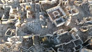 epa11811628 An aerial photograph taken with a drone shows damaged buildings at Al Shamiya village in Damascus, Syria, 07 January 2025, after opposition forces toppled president Bashar al-Assad. The village, which was built as a set for the production of a popular Syrian television series featuring houses, cafes, theaters, and museums, was damaged during the Syrian civil war that began in 2011. Productions at the site included Bab Al-Hara (The Neighbourhood's Gate), a popular television series in the Arab world.  EPA/MOHAMMED AL RIFAI