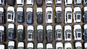 epa12016610 An image taken with a drone shows new Volvo automobiles awaiting transport from the Dundalk Marine Terminal in Baltimore, Maryland, USA, 07 April 2025. In an attempt to bolster US auto production, the Trump administration has placed a 25 percent tariff on imported cars and car parts.  EPA/JIM LO SCALZO