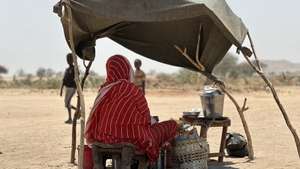 epa12049104 A Sudanese person, who fled from the internally displaced persons (IDP) Zamzam camp, rests while on their way to the Tawila Camps amid the ongoing conflict between Sudan's army and the Rapid Support Forces (RSF), in North Darfur, Sudan, 23 April 2025. The RSF claimed control of the Zamzam camp after its assault in April 2025. According to the UNHCR, over four million people have fled Sudan to neighboring countries since the outbreak of the armed conflict in April 2023.  EPA/MARWAN MOHAMED
