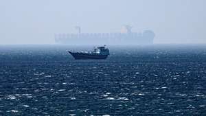 epa12194516 A ship sails in the Strait of Hormuz as seen from Khasab, Musandam Governorate, Oman, 24 June 2025. The Iranian parliament approved a measure to close the Strait of Hormuz following US strikes on three of Iran's key nuclear sites on 22 June 2025. Israel and Iran have been exchanging fire since Israel launched strikes across Iran on 13 June 2025.  EPA/ALI HAIDER