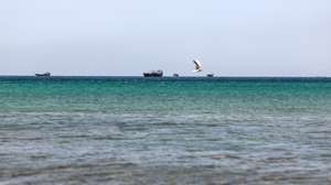 epa12194527 Ships in the Strait of Hormuz as seen from Khasab, Musandam Governorate, Oman, 24 June 2025. The Iranian parliament approved a measure to close the Strait of Hormuz following US strikes on three of Iran's key nuclear sites on 22 June 2025. Israel and Iran have been exchanging fire since Israel launched strikes across Iran on 13 June 2025.  EPA/ALI HAIDER
