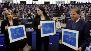 epa11024255 Iranian activists Mersedeh Shahinkar (L) and Afsoon Najafi (C), and Saleh Nikbakht (R), the attorney representing the family of Mahsa Amini, pose during the Sakharov Prize award ceremony at the European Parliament in Strasbourg, France, 12 December 2023. Members of the European Parliament have awarded the 2023 Sakharov Prize for Freedom of Thought to late Jina Mahsa Amini and the &quot;Woman, Life, Freedom movement&quot; in Iran.  EPA/RONALD WITTEK