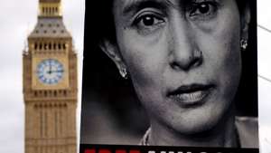 epa12289632 A person holds a placard of former State Counsellor of Myanmar Aung San Suu Kyi as Burmese people gather to mark the 08 August uprising against the military junta in Myanmar at Parliament Square in London, Britain, 08 August 2025. The 8888 Uprising, also known as the People Power Uprising, was a series of nationwide protests, marches, and riots against the military junta across Burma that peaked in August 1988.  EPA/ANDY RAIN