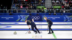 epa12724460 Isabella Wranaa and Rasmus Wranaa of Sweden in action during the gold medal match between Sweden and the USA in the Mixed Doubles of the Curling competition, at the Milano Cortina 2026 Winter Olympic Games in Cortina d'Ampezzo, Italy, 10 February 2026.  EPA/JURE MAKOVEC