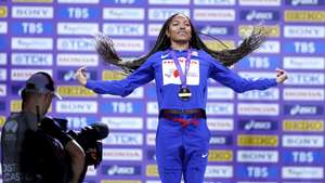 epa12379550 Gold medalist Tara Davis-Woodhall of the USA during the medal ceremony for the Women's Long Jump at the World Athletics Championships 2025 in Tokyo, Japan, 15 September 2025.  EPA/KIYOSHI OTA