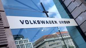 epa13099889 A Volkswagen logo at a car exhibition of VW in Berlin, Germany, 09 July 2026. Volkswagen's management is presenting its restructuring plans to the supervisory board. Europe’s largest automaker is suffering from US tariffs, lower profit margins on electric cars, and intense competition in China, the world’s largest automotive market. VW plans to cut 50,000 jobs in Germany by 2030, including 35,000 at the Volkswagen brand.  EPA/HANNIBAL HANSCHKE
