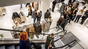 epa10980519 Visitors walk at a Zara store during the opening of the largest store in the world of the Zara fashion chain in Rotterdam, The Netherlands, 17 November 2023. The opening of the newest branch fits within the strategy of the Spanish parent company Inditex, focusing on fewer but larger stores.  EPA/ROBIN UTRECHT