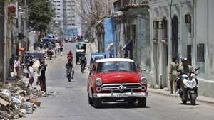 epaselect epa12905026 A vehicle drives down a street in Havana, Cuba, 20 April 2026 (issued 21 April 2026). Cuban President Miguel Diaz-Canel has participated in an atypical series of interviews with international media organizations over the past several weeks amid tensions with the USA.  EPA/ERNESTO MASTRASCUSA