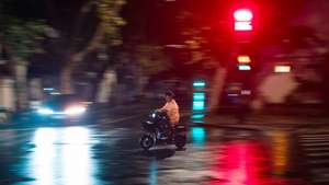 epa11606417 A person rides a scooter on a street during heavy rain amid Typhoon Bebinca in Shanghai, China, 16 September 2024. Shanghai, China&#039;s financial hub, has closed its seaports and canceled over 600 flights in preparation for Typhoon Bebinca, expected to be the strongest tropical storm to hit the city in 75 years. More than 377,000 people were evacuated, and the Mid-Autumn Festival&#039;s mood has been dampened by the potential for up to 10 inches of rain.  EPA/ALEX PLAVEVSKI