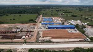 epa09605422 A photo taken with a drone shows the China Communications Construction Company (CCCC)-run construction yard in the town of El Triunfo, municipality of Balancan, in Tabasco, Mexico 25 November 2021 (issued 26 November 2021). The Maya Train project, one of the flagship works of the Government of Mexican President Andres Manuel Lopez Obrador, has been delayed by at least five months due to bureaucracy and geological faults, as revealed on 26 November by the general director of the National Fund for the Promotion of Tourism (Fonatur), Rogelio Jimenez. CCCC and Mota-Engil won the Mayan Train contract.  EPA/Manuel Lopez