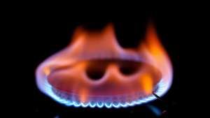 epa10030210 A photo illustration shows a gas burner on a table cooker in Essen, Germany, 23 June 2022. The German government declared on the day an alert in the emergency gas plan, given the decrease in supply from Russia and high prices.  EPA/FRIEDEMANN VOGEL