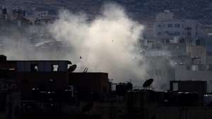 epa11580236 Smokes rises over Jenin refugee camp  during the sixth day of an Israeli military operation in the West Bank city of Jenin, 02 September 2024. According to the Palestinian Health Ministry, at least 27 Palestinians have been killed since Israeli military operations started on 28 August 2024 in the West Bank cities of Tulkarem, Jenin, and Tubas. The Israeli army said that it&#039;s conducting a large-scale &#039;counterterrorism operation&#039; in several areas.  EPA/ALAA BADARNEH