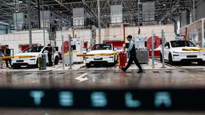 epa12889777 Employees work in the Tesla Gigafactory assembly line, during a government-organized visit, in Shanghai, China, 14 April 2026. Tesla entered the Chinese mainland market in 2013, and on 07 January, 2019, Gigafactory Shanghai broke ground, becoming its first manufacturing facility outside the US by 30 December of the same year. The factory had started delivering 'Made-in-China' Model 3 vehicles. In 2025, Gigafactory Shanghai delivered 851,000 electric vehicles, over half of Tesla's global deliveries that year. The factory serves two roles: manufacturing for the Chinese market and acting as a global export hub. It produces the Model 3, Model Y, and the six-seat Model Y La SUV, which was unveiled in August 2025. China's advanced manufacturing ecosystem and supply chain make Gigafactory Shanghai one of the world's most competitive auto manufacturing sites.  EPA/ALEX PLAVEVSKI