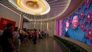 epa13077477 People watch a film with Chinese President Xi Jinping during their visit to the Memorial Hall of the First National Congress of the Communist Party of China (CCP) amid the celebrations of the CCP 105 anniversary, in Shanghai, China, 01 July 2026. China celebrates the 105th anniversary of the founding of the ruling Chinese Communist Party on 01 July.  EPA/ALEX PLAVEVSKI