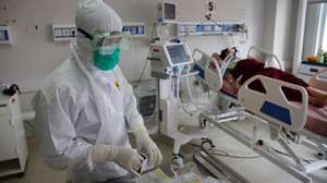 epa09294741 An intensive care unit (ICU) worker conducts a routine medical checkup for a COVID-19 patient at Bogor City Hospital, Indonesia, 23 June 2021. Indonesia has recorded over two million COVID-19 cases since the beginning of the pandemic.  EPA/ADI WEDA
