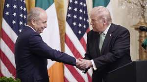 epa12828705 US President Donald Trump (R) attends the Shamrock Bowl presentation By Irish Taoiseach Micheal Martin (L) to celebrate St. Patrick's Day at the White House in Washington, DC, USA, 17 March 2026.  EPA/YURI GRIPAS / POOL
