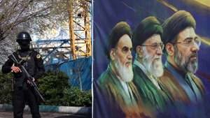 epa12861673 A member of the Iranian security forces stands guard next to a banner showing former and current Iranian supreme leaders, in Tehran, Iran, 31 March 2026. A joint US and Israeli military operation, launched on 28 February, continues to target strategic sites across Iran.  EPA/ABEDIN TAHERKENAREH