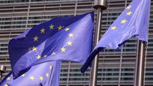 epa13143984 EU flags wave in front of the European Commission headquarters in Brussels, Belgium, 31 July 2026. The Commission is planning a briefing on the situation in the Spanish enclave of Ceuta amid a sharp increase in migrant arrivals. Thousands of migrants attempted to cross into Ceuta from Morocco in recent days.  EPA/OLIVIER HOSLET