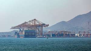epa13095211 A container ship docks at Khor Fakkan Port, in Khor Fakkan, United Arab Emirates, 07 July 2026. As one of the upcoming measures for the UAE to avoid sending its shipping vessels through the Strait of Hormuz following disruptions caused by attacks on vessels during the recent regional conflict between the US, Israel, and Iran, Khor Fakkan Port will undergo expansion. Gulftainer, which operates Khor Fakkan Port, unveiled a global trade infrastructure strategy to build the Middle East's largest integrated logistics ecosystem.  EPA/ALI HAIDER