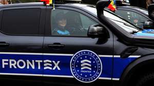 epa12562617 Romanian customs officers march inside their EU Frontex  border mission patrol vehicles during a military parade organized to mark Romania's Great Union Day, in Bucharest, Romania, 01 December 2025. Romania is celebrating Great Union Day, which commemorates the unification of the three historical provinces of Transylvania, Basarabia, and Bucovina with Romania in 1918. More than 2,900 Romanian soldiers and specialists, along with approximately 220 technical units, participated in the military parade at Triumph Arch Square. Additionally, around 240 NATO soldiers with 23 technical units from France, North Macedonia, Moldova, Poland, Portugal, Spain, and the USA also took part, representing allied countries contributing to NATO structures in Romania.  EPA/ROBERT GHEMENT