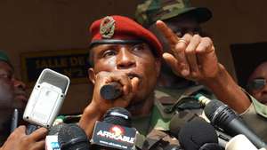 epa01954044 (File) A file photograph which was made available 29 September 2009 shows Guinea Junta head Capt Moussa Dadis Camara speaking to the media in Conakry, Guinea. According to media reports on 03 December 2009, Capt Camara has been allegedly shot at by one of his aides, but he "is well" and "out of danger".  EPA/STR *** Local Caption *** 00000401879863