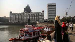 epa08843376 An exterior view of the Taj Mahal hotel, one of the sites of the Mumbai terror attacks, one of the sites of attacks, on the 12th anniversary of the Mumbai terror attacks, in Mumbai, India, 26 November 2020. A total of 171 people were killed and more than 300 others were injured when 10 heavily-armed Islamist militants stormed the city on 26 November 2008, attacking a number of sites, including the Chhatrapati Shivaji Maharaj Terminus railway station, as well as the two luxury hotels Taj Mahal Palace and Oberoi, the popular tourist restaurant Leopold Cafe and the Jewish centre Chabad House.  EPA/DIVYAKANT SOLANKI