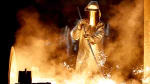 epa07760428 (FILE) - A steel worker takes a steel sample at blast furnace 8 of German corporation ThyssenKrupp in Duisburg, Germany, 07 April 2017 (reissued 07 August 2019). The German statistics bureau DESTATIS on 07 August 2019 state June 2019, production in industry excluding energy and construction was down by 1.8 per cent, when compared with 5.2 per cent in June 2018. The production of consumer goods showed a decrease by 1.4 per cent. Outside industry, energy production was down by 1.6 per cent in June 2019 and the production in construction increased by 0.3 per cent. Analysts say the decline may continue due to ongoing trade dispute between USA and China, both important for German exports.  EPA/FRIEDEMANN VOGEL