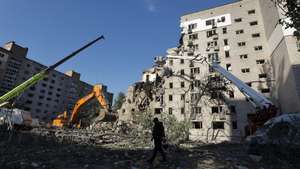 epaselect epa13079889 A Ukrainian rescuer walks at the site of a Russian missile strike on a nine-storey residential building in Kyiv, Ukraine, 02 July 2026, amid the Russian invasion. According to the State Emergency Service of Ukraine, at least 17 people were killed and more than 90 injured after a massive overnight Russian attack on Kyiv. The Ukrainian Air Force said Russia launched about 500 drones and more than 70 missiles of different types in the attack, with Kyiv the main direction of the assault.  EPA/SERGEY DOLZHENKO