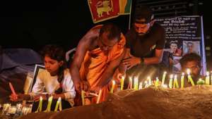 epa10074757 People light candles in memory of the protesters who were allegedly killed or wounded during the months-long protests and clashes against the economic crisis, near the Presidential Secretariat in Colombo, Sri Lanka, 16 July 2022. The Parliament of Sri Lanka accepted the resignation of President Gotabaya Rajapaksa after he fled to Singapore through the Maldives following months of anti-government protests fueled by the ongoing economic crisis. Protests have been rocking the country for over four months as Sri Lanka faces its worst-ever economic crisis in decades due to the lack of foreign reserves, resulting in severe shortages in food, fuel, medicine, and imported goods.  EPA/CHAMILA KARUNARATHNE
