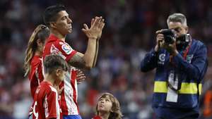 epa09949740 Atletico's Luis Suarez (2-L), accompanied by his family, bids farewell to Atletico supporters after the Spanish LaLiga soccer match between Atletico Madrid and Sevilla FC in Madrid, Spain, 15 May 2022. Uruguayan striker Luis Suarez played his last match for Atletico Madrid.  EPA/Chema Moya