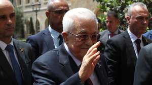 epa12125270 Palestinian President Mahmoud Abbas (C) waves to journalists upon his arrival to meet with the Lebanese prime minister at the Government Palace in Beirut, Lebanon, 22 May 2025. Abbas arrived in Beirut on 21 May for a three-day official visit to meet with Lebanese officials, as well as discuss issues related to the Palestinian refugees in Lebanon.  EPA/WAEL HAMZEH