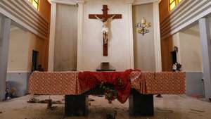 epa09999603 A cross on the altar stained with blood inside the St. Francis Catholic church a day after an attack by gunmen on worshippers during a Sunday service mass in Owo, Ondo state, Nigeria, 06 June 2022. According to Ondo state authorities over 50 people were killed and numerous others injured in the attack on the St. Francis Catholic church in Owo town, southwest Nigeria, during Pentecost Sunday mass on 05 June 2022.  EPA/STRINGER