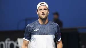 epa10410999 Joao Sousa of Portugal in action against Roberto Bautista Agut of Spain  during their first round match at the Australian Open tennis tournament in Melbourne, Australia 17 January 2023.  EPA/FAZRY ISMAIL