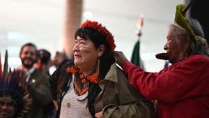 epa10446148 The new President of the National Foundation for Indigenous Peoples (Funai) Joenia Wapichana, together with the indigenous leader Cacique Raoni Metuktire (R), takes office as President, in Brasilia, Brazil, 03 February 2023.  EPA/Andre Borges