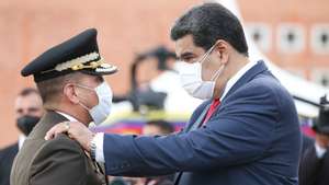 epa09330655 A handout photo made available by Miraflores Press shows President of Venezuela, Nicolas Maduro (R) along with Domingo Antonio Hernandez Larez (L), during a military and government act, in Caracas, Venezuela, 07 July 2021. Maduro renewed the military leadership by changing the commanders of the Army, the Navy, the Bolivarian National Guard (GNB, militarized police) and the head of the operational strategic command, although he ratified the Minister of Defense, Vladimir Padrino.  EPA/Miraflores Press / HANDOUT  HANDOUT EDITORIAL USE ONLY/NO SALES