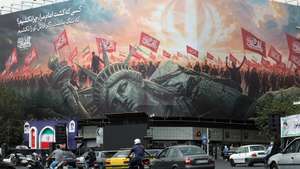 epa13224596 Iranians drive past an anti-US billboard in Tehran, Iran, 09 September 2026. Iran’s Islamic Revolutionary Guard Corps (IRGC) claims to have captured a US military underwater drone at the entrance to the Strait of Hormuz as the conflict between Iran and the US continues as both sides trade fire.  EPA/ABEDIN TAHERKENAREH RESTRICTIONS: ISRAEL OUT- NO Access Israel Media/Persian Language TV Stations Outside Iran/Strictly No Access BBC Persian/VOA Persian/Manoto TV/Iran International TV. (As mandated by Iran's Directorate General for Foreign Media)