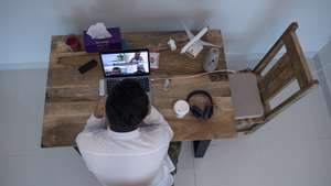 epa08321820 Mohamed Nader, 25, digital marketing manager, works from his home in Sharjah, United Arab Emirates, 24 March 2020. Most companies, including the Emirates federal government, are opting for teleworking to limit the spread of the covid-19 coronavirus.Nader says that 'the most negative thing about working at home is that you do not see people and communicate with people like drinking coffee with colleagues, But there are some positives points from home such as organizing work time and not wasting time in side conversations that have nothing to do with work'. EPA/Mahmoud KHALED ATTENTION: This Image is part of a PHOTO SET