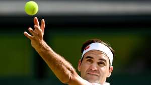 epa09329194 Roger Federer of Switzerland serves during the men's quarter final match against Hubert Hurkacz of Poland at the Wimbledon Championships, in Wimbledon, Britain, 07 July 2021.  EPA/NEIL HALL   EDITORIAL USE ONLY