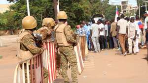 epa10216248 Burkina Faso military close a street in Ouagadougou, Burkina Faso, 30 September 2022. Gunshots have been heard near the presidential palace in Ouagadougou with what some residents claim to be an alleged coup attempt. Access has been blocked by the military to some government buildings including the national assembly and the national broadcaster. In January 2022 the current head of state, Lt-Col Paul-Henri Damiba, ousted President Roch Kabore through a coup. Lieutenant Colonel Paul-Henri Damiba has called for calm.  EPA/ASSANE OUEDRAOGO