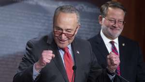 epa10353724 Senate Majority Leader Chuck Schumer (L) and Democratic Senator from Michigan Gary Peters (R) hold a news conference to discuss the expansion of Democrats&#039; majority in the Senate, on Capitol Hill in Washington, DC, USA, 07 December 2022. With the victory of Democratic Senator of Georgia Raphael Warnock over Republican candidate Herschel Walker, Democrats expand their seats in the US Senate to 51, easing confirmation of judicial nominees and passage of Democrats&#039; legislative agenda.  EPA/MICHAEL REYNOLDS