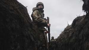 epa10384141 Ukrainian servicemen on their position near the city of Bakhmut in the Donetsk area, Ukraine, 31 December 2022 prior to the New Year celebration. Heavy fighting took place in the area during a Russian offensive in November 2022. Bakhmut is still without heating, electricity, and gas due to permanent shelling. Russian troops entered Ukraine on 24 February 2022 starting a conflict that has provoked destruction and a humanitarian crisis.  EPA/GEORGE IVANCHENKO