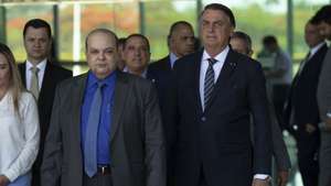 epa10225034 The president of Brazil and candidate for re-election, Jair Bolsonaro (R), and the governor-elect of Brasilia, Ibaneis Rocha (L), participate in a press conference, in the Palacio da Alvorada, in Brasilia, Brazil, 05 October 2022. Bolsonaro will face Former Brazilian President Luiz Inacio Lula da Silva (PT) in the second round of the presidential elections on 30 October. Together, Lula and Bolsonaro received 108 million votes (91.6%). According to the Superior Electoral Court (TSE), in the first round, Lula obtained 57 million votes (48.4%) and Bolsonaro, 51 million votes (43.2%).  EPA/Joedson Alves