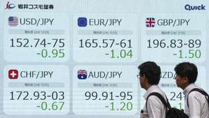 epa11495370 Pedestrians walk past a display showing the foreign exchange rates against Japanese yen in Tokyo, Japan, 25 July 2024, after Tokyo's stock benchmark plunged nearly 1,300 points. The Nikkei Stock Average was down 1,285.34 points, or 3.28 per cent, to close at 37,869.51, the biggest single-day loss in eight years while Japanese currency rose to near mid-152 yen level against US dollar.  EPA/KIMIMASA MAYAMA