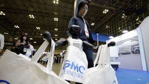 epa13012912 A Booster robot holds bags of the GMO Internet Group booth at the Japan Drone Expo 2026 in Chiba, near Tokyo, Japan, 03 June 2026. The expo is open to the public until 05 June 2026.  EPA/FRANCK ROBICHON