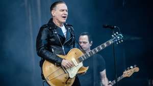 epa11444307 Canadian singer-songwriter and musician Bryan Adams performs at the Tinderbox music festival in Odense, Denmark, 28 June 2024 (issued 29 June 2024). The festival runs from 27 to 29 June 2024.  EPA/HELLE ARENSBAK  DENMARK OUT