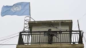 epa12578804 A peacekeeper of Nepal's UNIFIL peacekeeping forces looks at the Lebanese-Israeli border, from an observation tower inside the Nepbatt headquarters in Meiss al-Jabal, Marjayoun district, southern Lebanon, 08 December 2025. The UN Security Council in August voted unanimously to extend for a final time the mandate of UNIFIL until 31 December 2026, after which will start an orderly and safe drawdown and withdrawal within one year.  EPA/WAEL HAMZEH