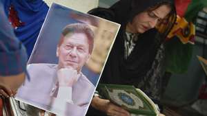 epa11528186 Supporters of the Pakistan Tehreek-e-Insaf (PTI) party read copy of Quran to mark a prison anniversary of former Prime Minister and chairman of opposition political party Pakistan Tehrik-e-Insaf (PTI) Imran Khan, in Karachi, Pakistan, 05 August 2024. The day marks one year since Imran Khan was imprisoned on corruption charges. Khan remains in jail with new charges, while his wife Bushra Bibi also faces imprisonment despite an earlier reprieve.  EPA/SHAHZAIB AKBER